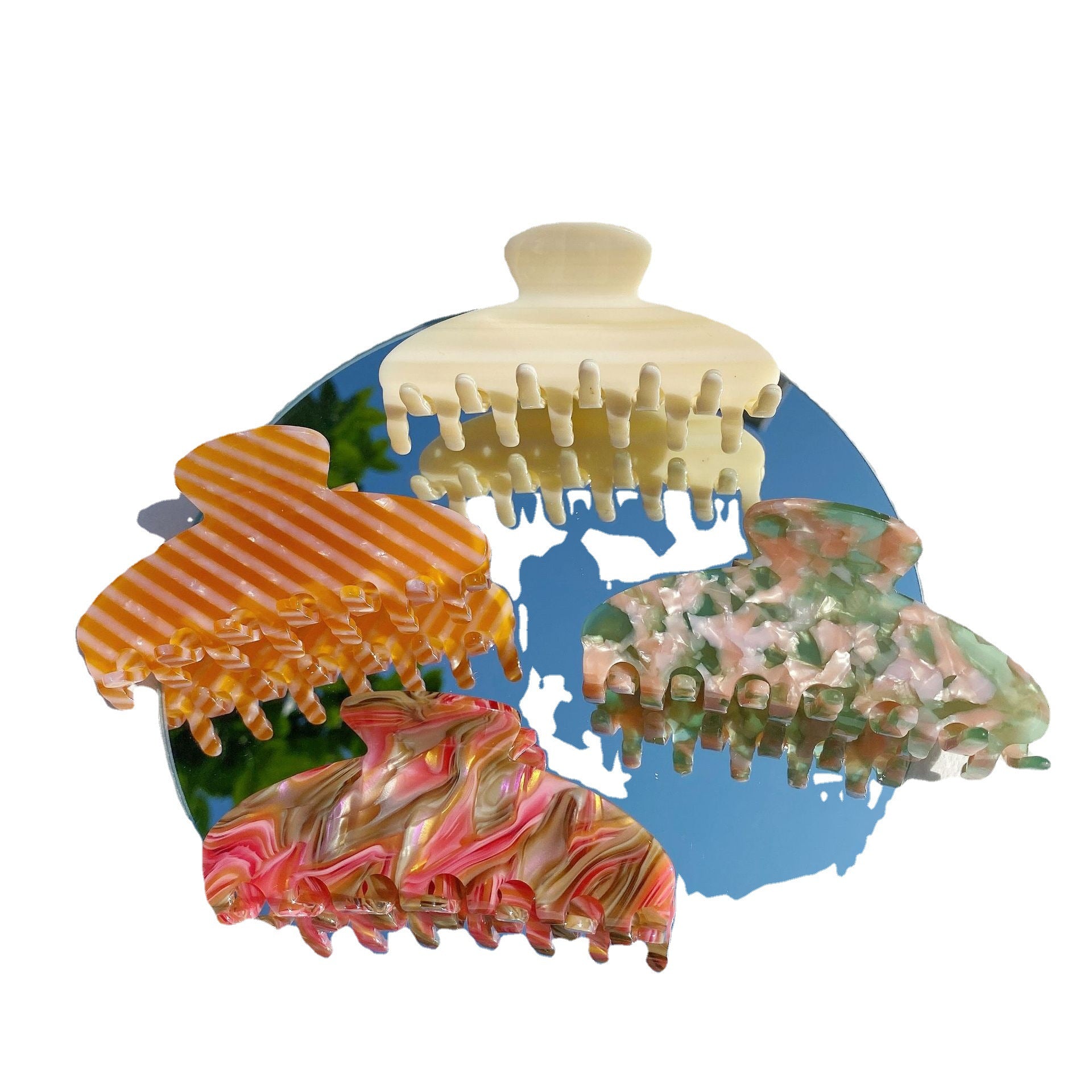 Colorful acrylic hair claws set on a round mirror, trendy fashion accessories by FashionRay