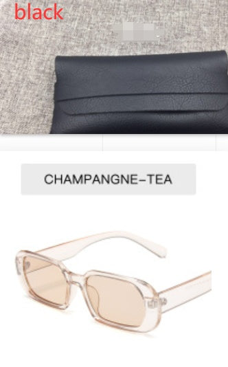 FashionRay black sunglasses case and champagne-tea rectangular sunglasses on gray fabric