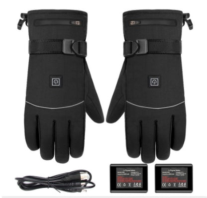 Black heated winter gloves with power button, batteries, and charging cable on white background