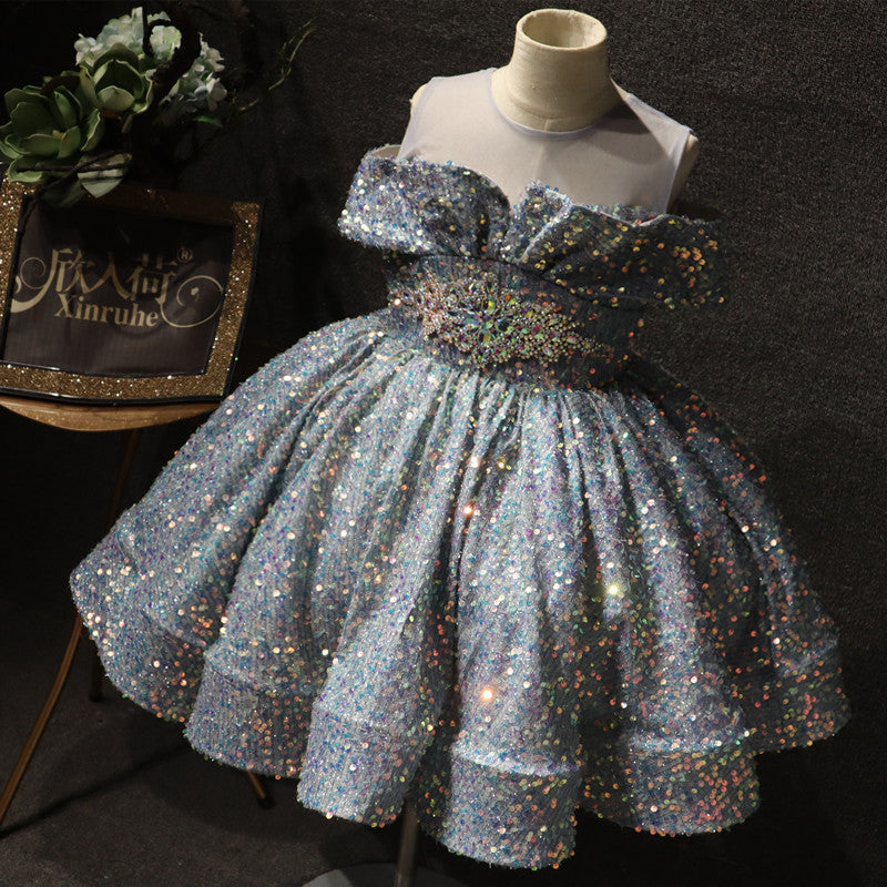 Glittery blue sequin party dress with ruffled bodice on mannequin, FashionRay kids fashion