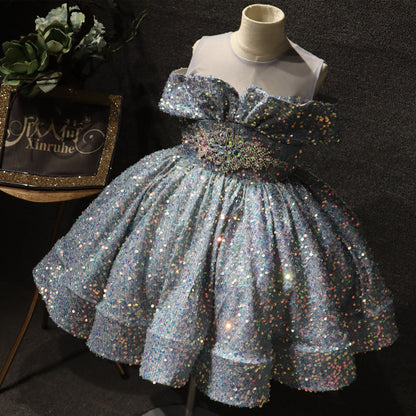 Glittery blue sequin party dress with ruffled bodice on mannequin, FashionRay kids fashion