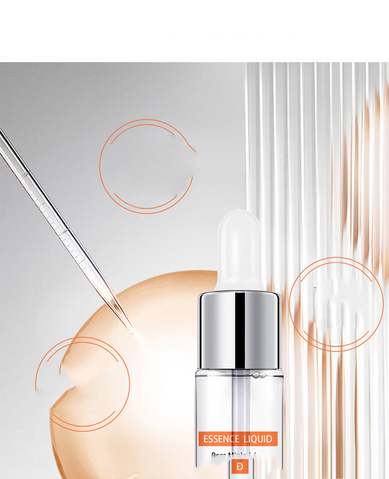 Clear serum dropper bottle labeled ESSENCE LIQUID on white background with pipette and stylish accents