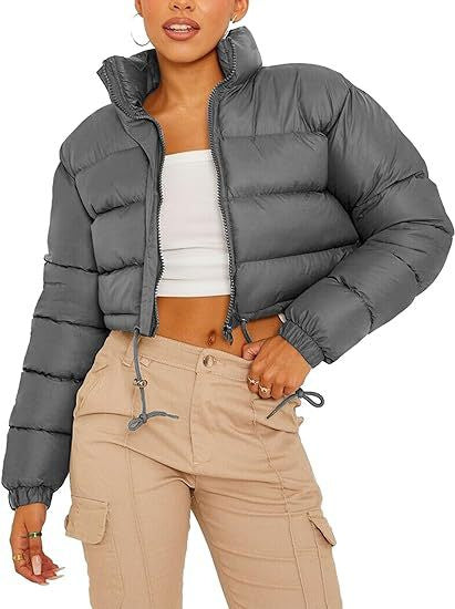 Woman wearing a gray puffer jacket, white crop top, and beige cargo pants, FashionRay style