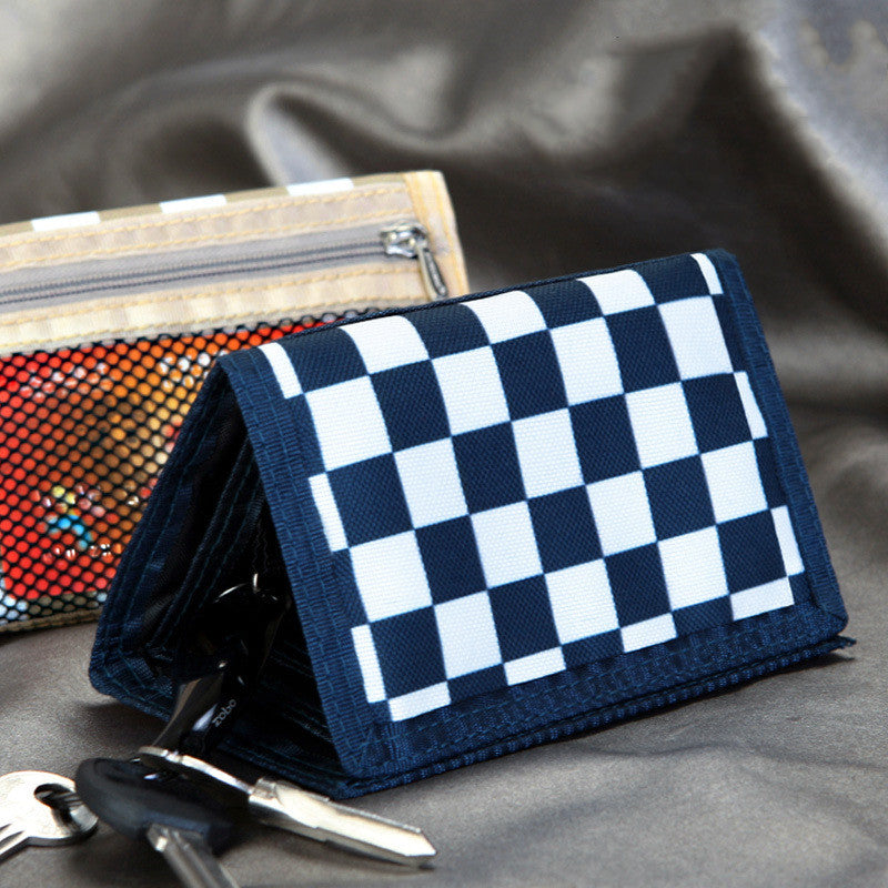 Navy blue checkered wallet with keys, stylish accessory from FashionRay on satin fabric