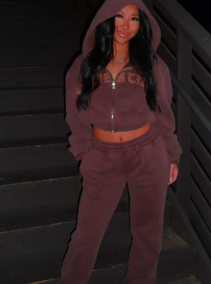 Woman in brown hoodie and sweatpants on stairs, trendy FashionRay loungewear style