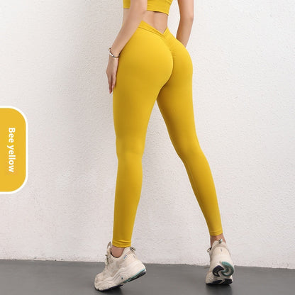 Woman wearing bee yellow high-waisted leggings and crop top, FashionRay activewear