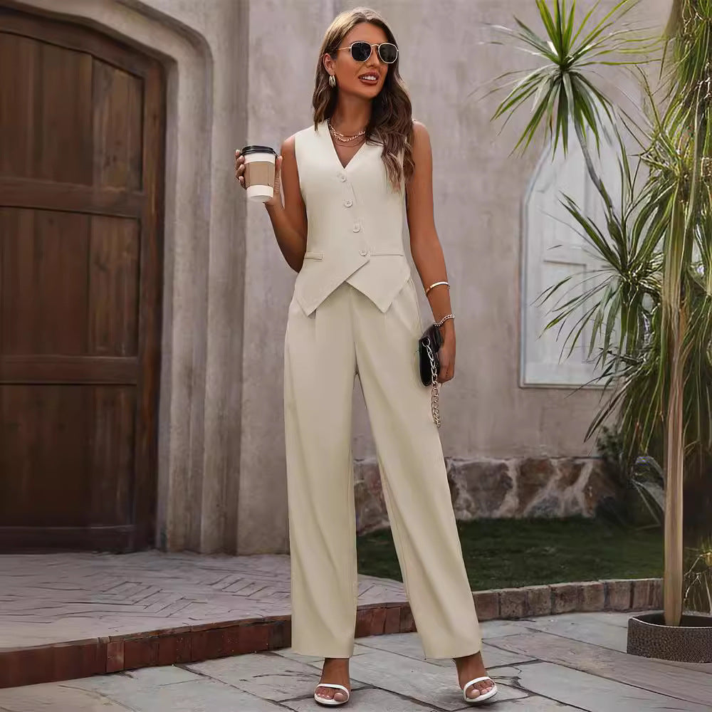 Woman in cream sleeveless vest pantsuit with sunglasses, holding coffee, stylish FashionRay look