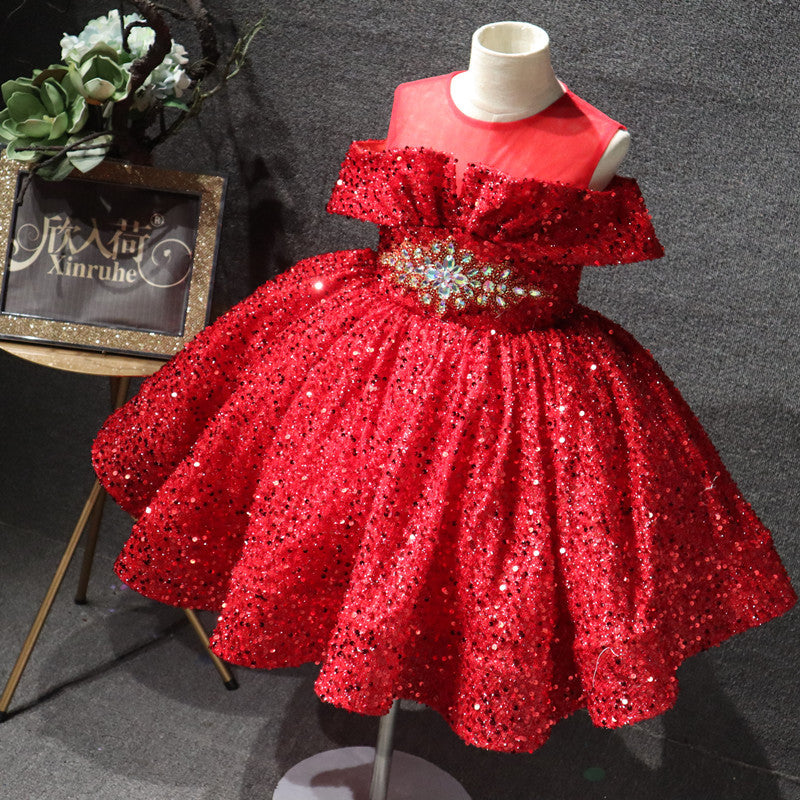 Sparkling red sequin girl's dress with floral embellishment on display, FashionRay style