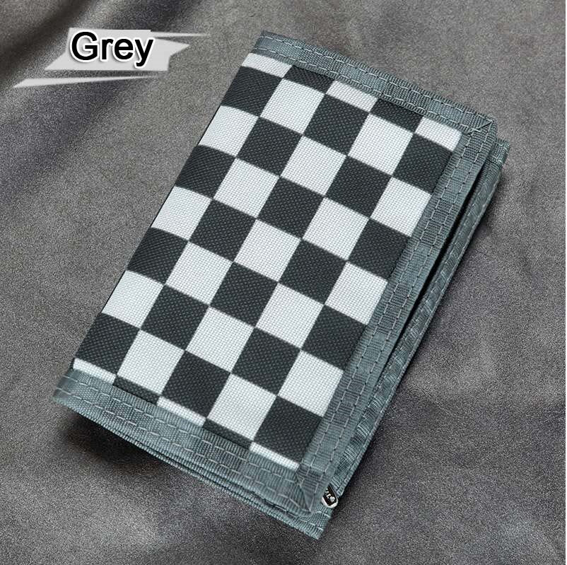 Grey checkered wallet on grey fabric, FashionRay trendy accessory