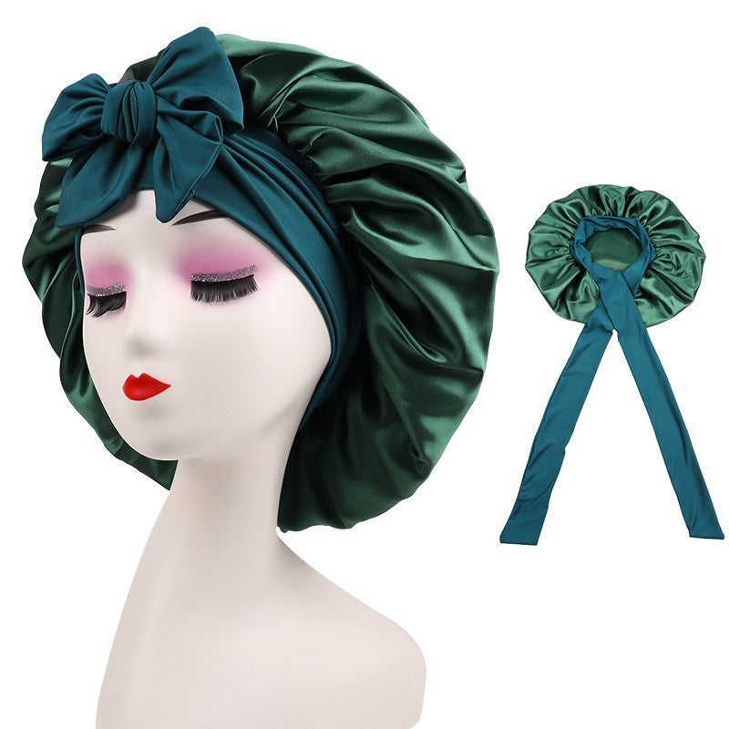 Satin green bonnet with bow, displayed on mannequin, FashionRay trendy hair accessory