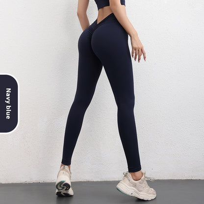 Woman modeling FashionRay navy blue high-waist leggings and crop top with sporty sneakers