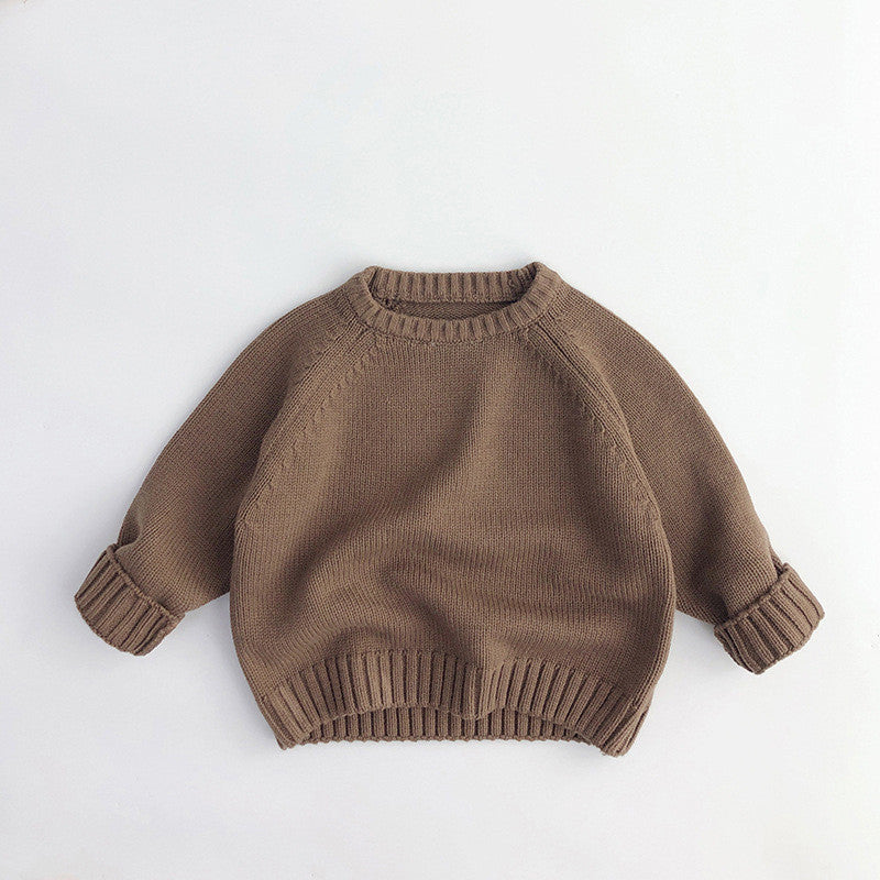 Brown knit sweater with ribbed cuffs and hem on white background, FashionRay cozy style