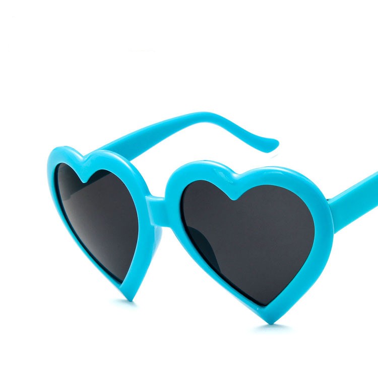 Blue heart-shaped sunglasses with black lenses on white background, trendy FashionRay accessory