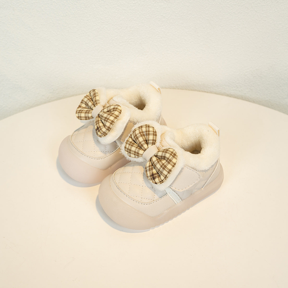 Cream baby shoes with plaid bows and faux fur lining on white background, FashionRay kids footwear