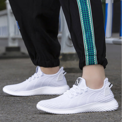 FashionRay white athletic sneakers with textured sole, worn outdoors with black joggers