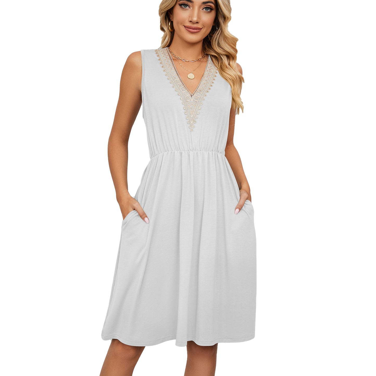 Woman wearing sleeveless white V-neck midi dress with pockets, trendy FashionRay style