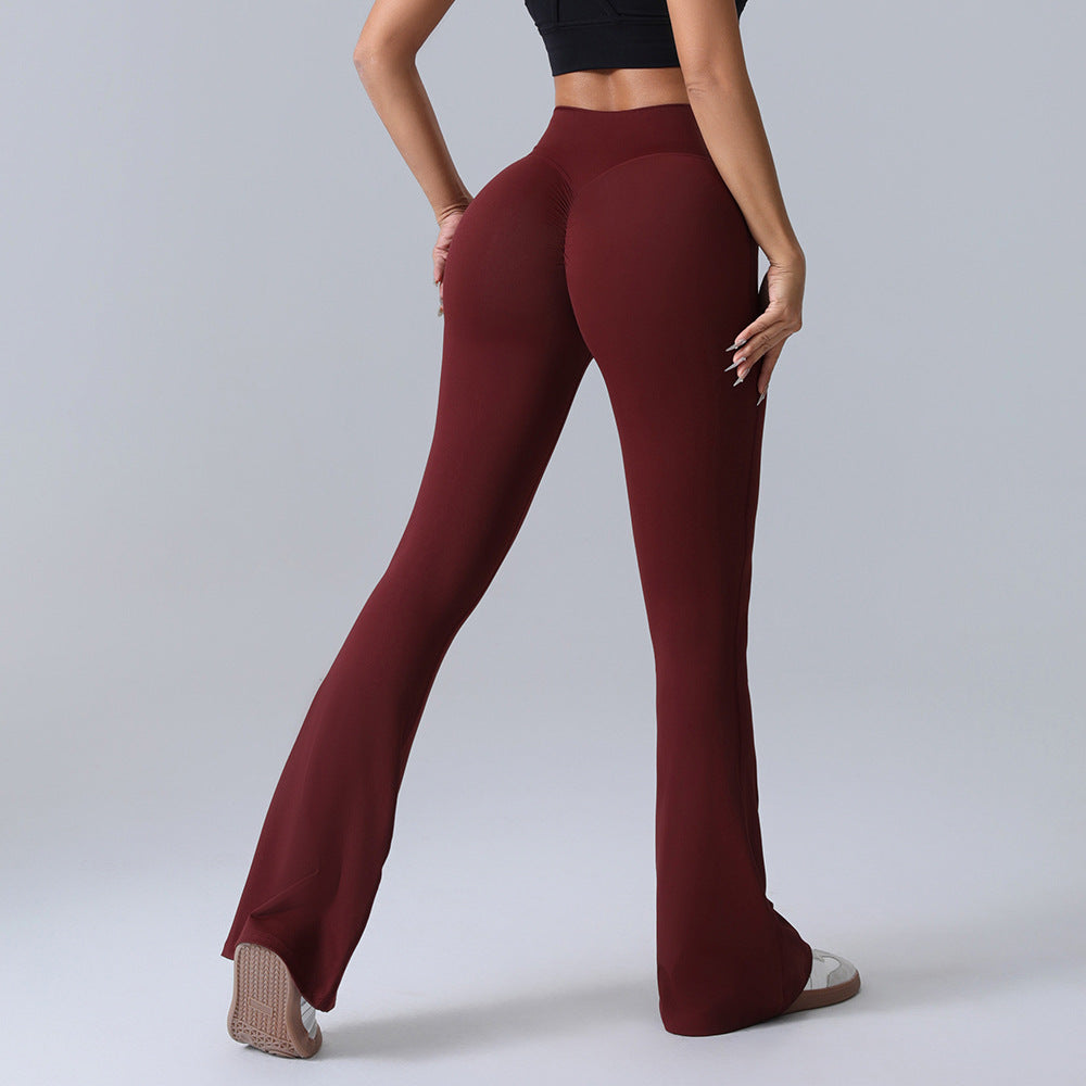 Woman wearing high-waisted burgundy flare leggings and a black crop top, FashionRay style