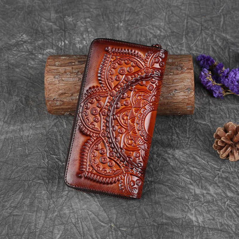 FashionRay embossed brown leather wallet with artistic pattern on rustic background