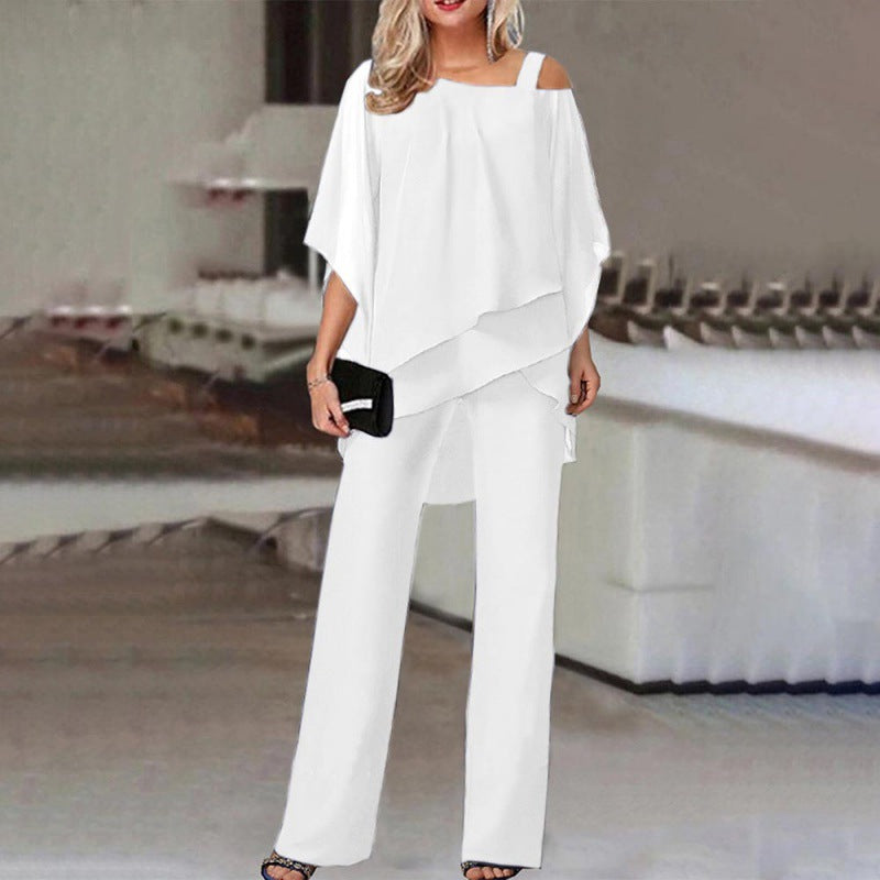 Woman in a trendy white two-piece pants set with off-shoulder top, FashionRay style