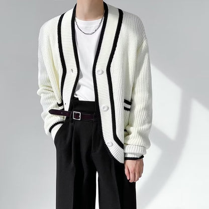 Trendy white knit cardigan with black trim, white t-shirt, and black pants from FashionRay