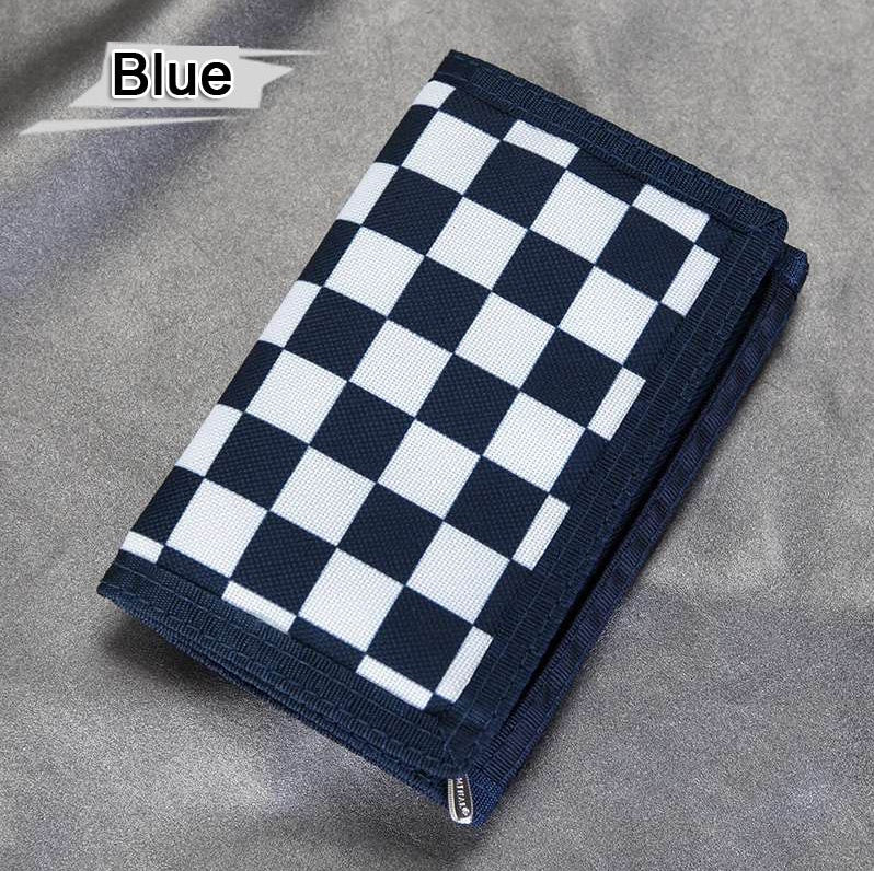 Blue and white checkered wallet on grey fabric, trendy accessory at FashionRay