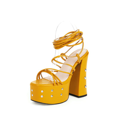 Yellow platform high heel sandal with strappy design and silver stud accents, FashionRay