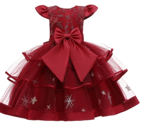 Elegant red toddler dress with tulle layers, large bow, and delicate star embroidery, FashionRay.