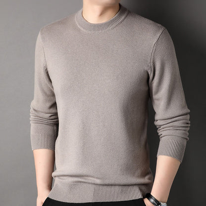 Man wearing a light brown knit crewneck sweater, FashionRay trendy casual outfit.