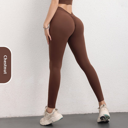 Woman wearing chestnut brown high-waist leggings from FashionRay, sporty and comfortable style
