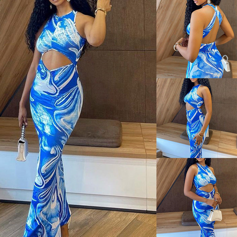 Woman in a bold blue marble cutout maxi dress, trendy summer fashion by FashionRay