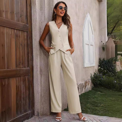 Woman in beige sleeveless pantsuit and sandals posing outdoors, chic summer fashion style
