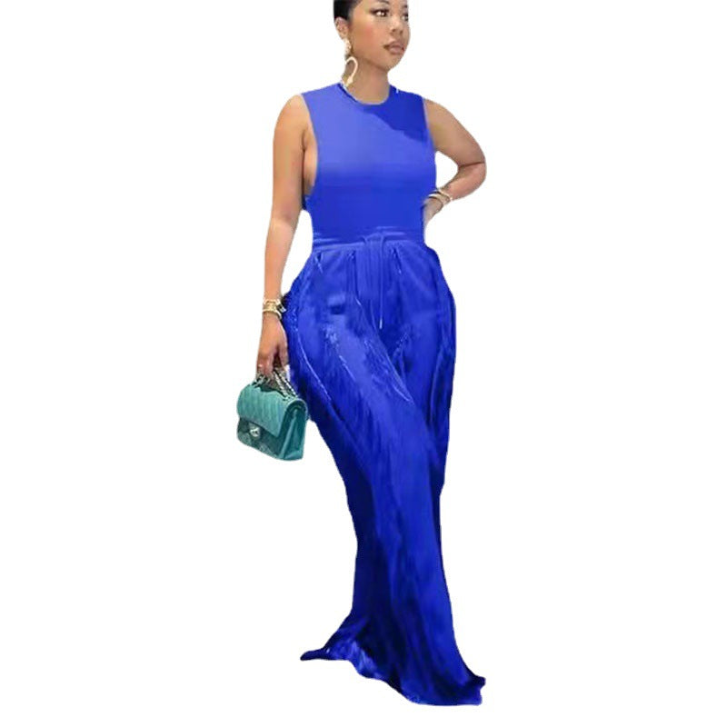 Woman in bold blue sleeveless maxi dress with handbag, FashionRay trendy style