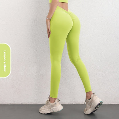 Woman wearing FashionRay lemon yellow high-waisted leggings and sneakers, side view