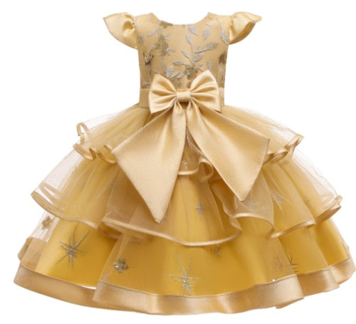 Gold floral layered dress with large satin bow, ruffled sleeves, and metallic accents, FashionRay