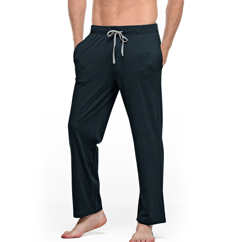 Men's black drawstring lounge pants with pockets from FashionRay, barefoot model