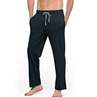 Men's black drawstring lounge pants with pockets from FashionRay, barefoot model