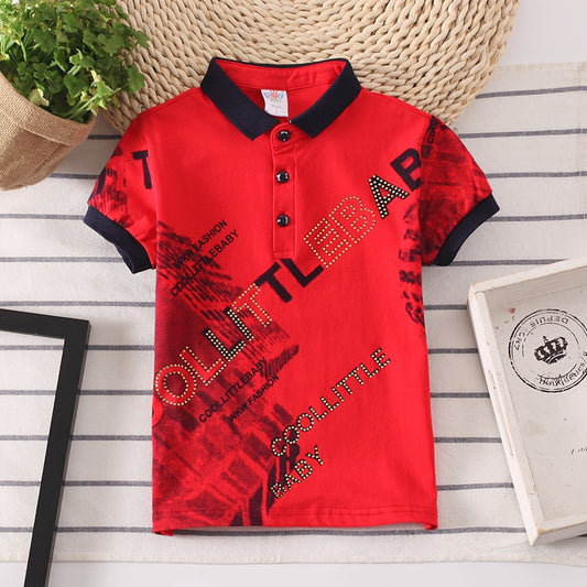 Red kids polo shirt with black collar, bold graphic COOL LITTLE BABY text, trendy FashionRay style.