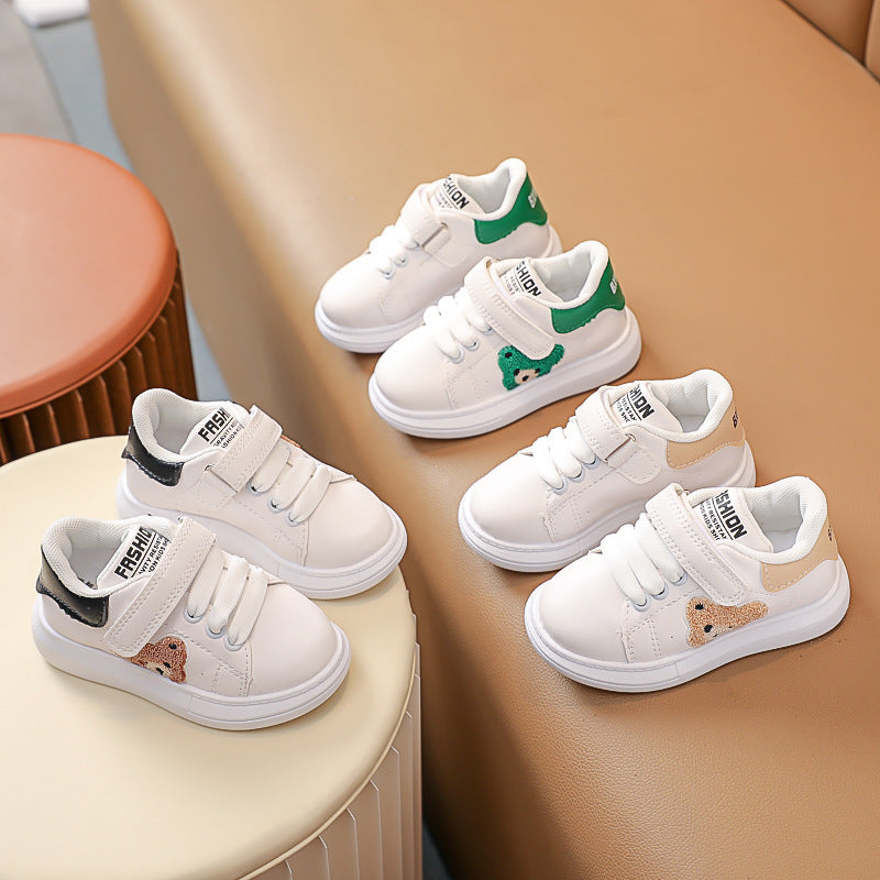 FashionRay kids' white sneakers with bear patch, velcro straps, and colored heels on display.