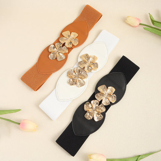 Trendy FashionRay elastic belts in tan, white, and black with gold floral buckles