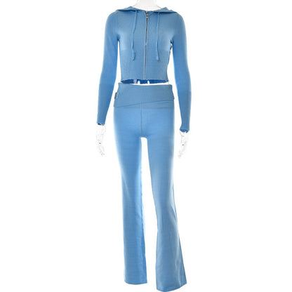 Light blue ribbed knit two-piece set with zip-up cropped hoodie and flared pants on mannequin