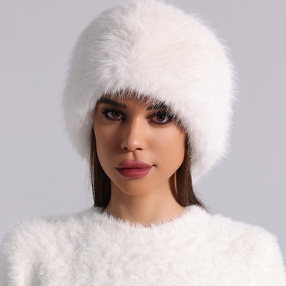Woman in white faux fur hat and sweater, FashionRay bold trendy winter style