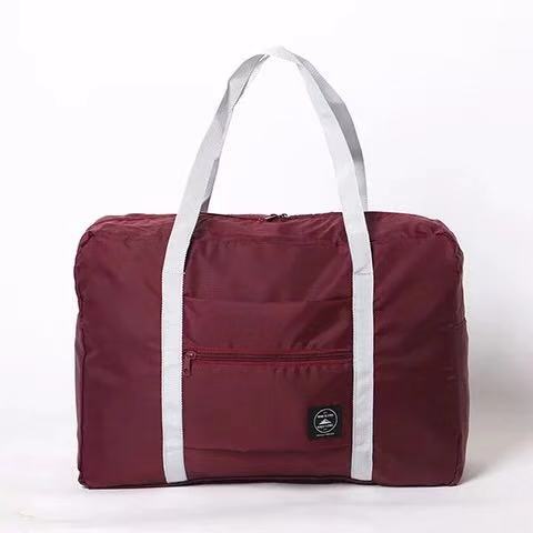 Burgundy travel duffel bag with white straps on white background, FashionRay accessory