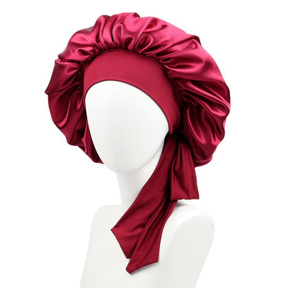 Satin burgundy bonnet with bow on mannequin, FashionRay trendy headwear for comfort and style