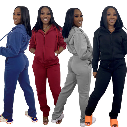 Woman modeling FashionRay trendy zip-up sweat suits in blue, red, gray, and black.