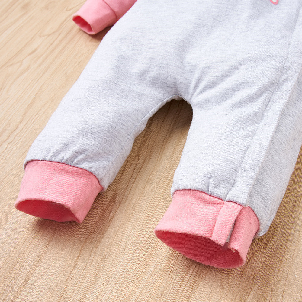 Gray baby jumpsuit with pink cuffs on a wooden floor, FashionRay kidswear