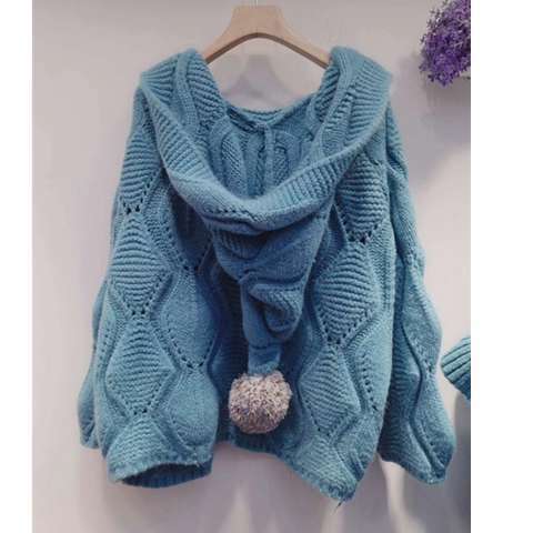 Chunky knit blue hooded sweater with pom-pom, cozy winter fashion from FashionRay.