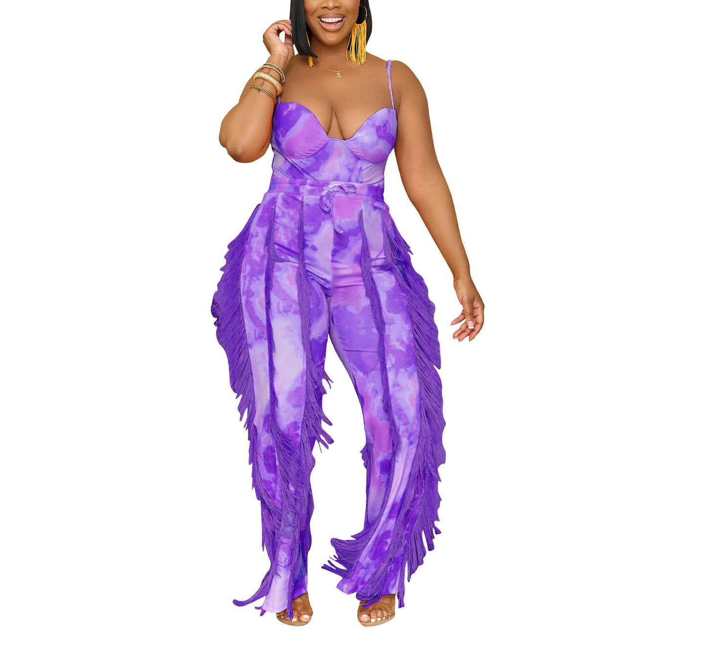 Woman modeling a bold purple tie-dye fringe jumpsuit from FashionRay on white background