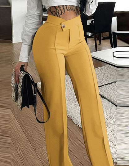 Woman modeling high-waisted yellow pants and white crop top in modern living room, FashionRay style