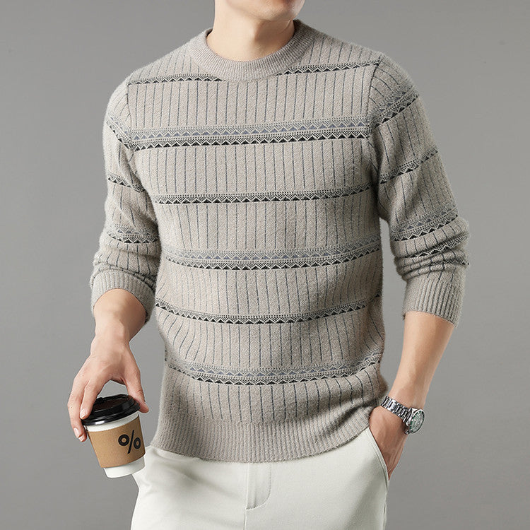 Man in striped beige knit sweater and white pants holding coffee, modern casual fashion
